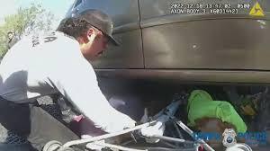 Police Good Samaritans Save Baby Trapped Under Car